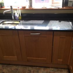 Oak door kitchen with black granite work tops
