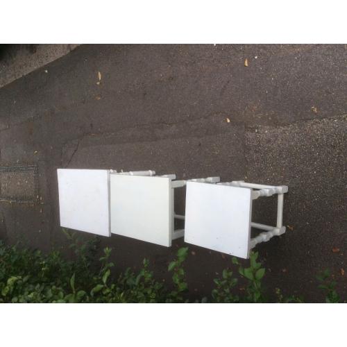 Nest of three white painted wood tables
