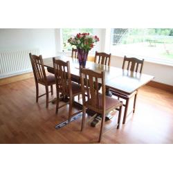 Oak dining table and six chairs