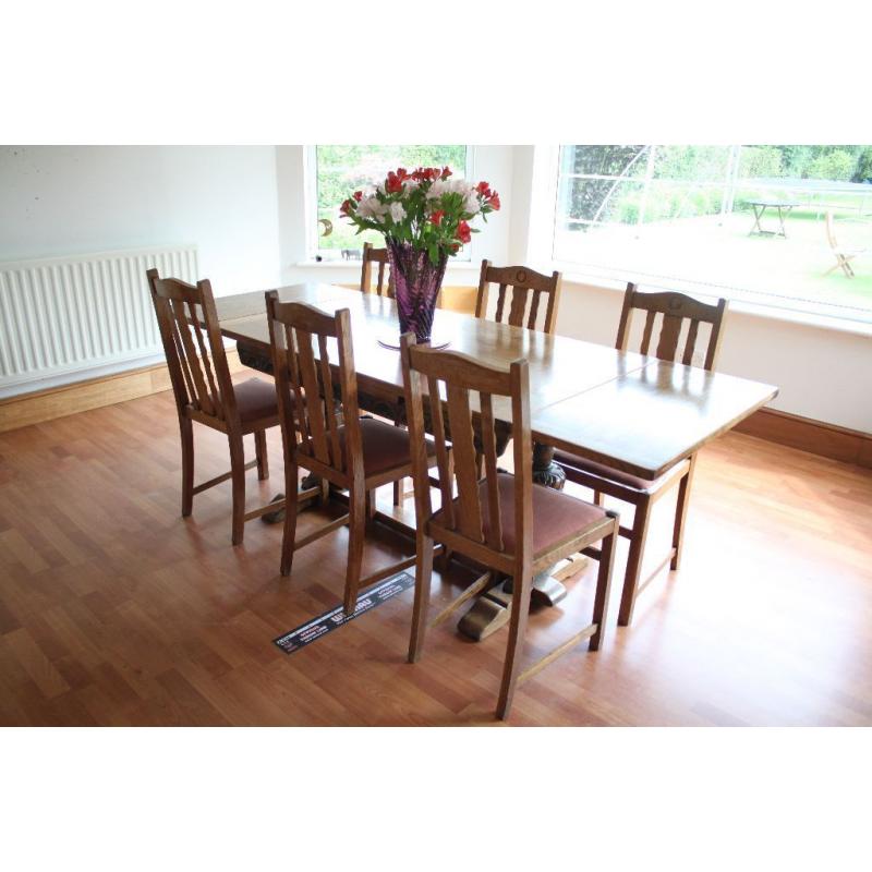 Oak dining table and six chairs