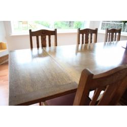 Oak dining table and six chairs