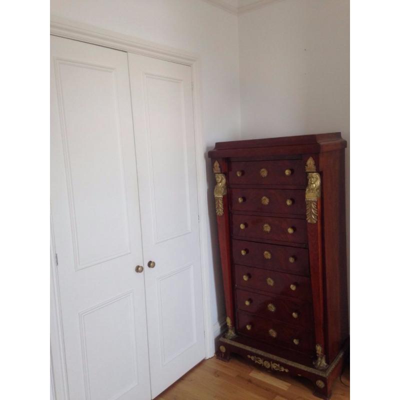 TWO red/chestnut drawer chests - identical with 7 drawers each
