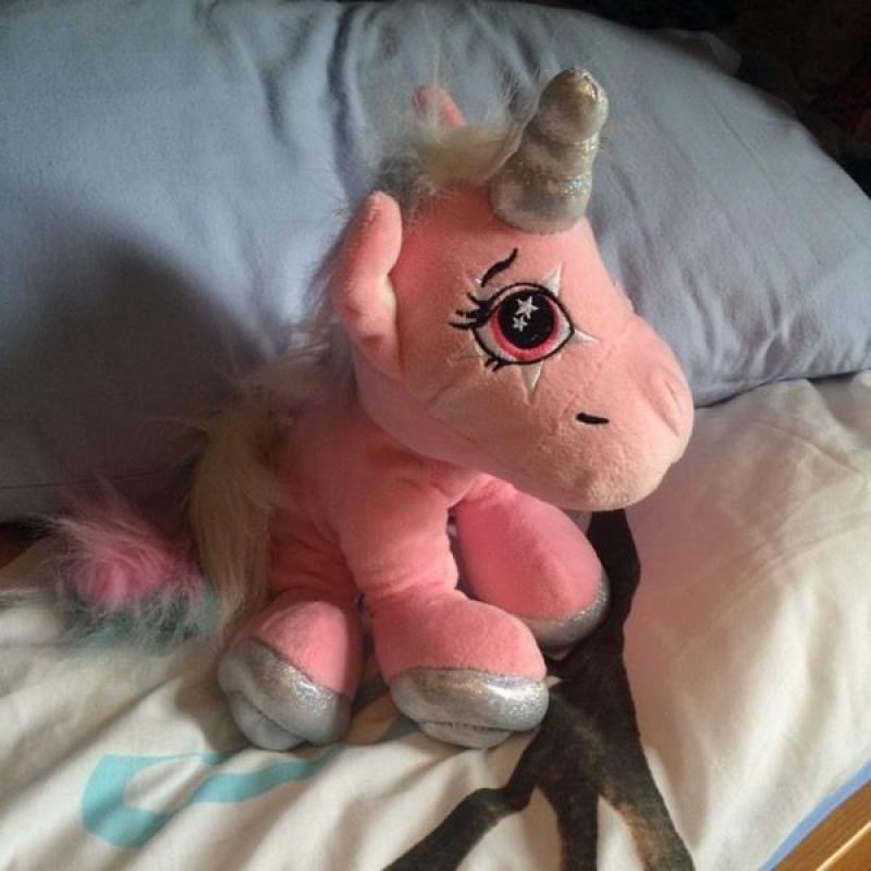 Pink unicorn soft toy