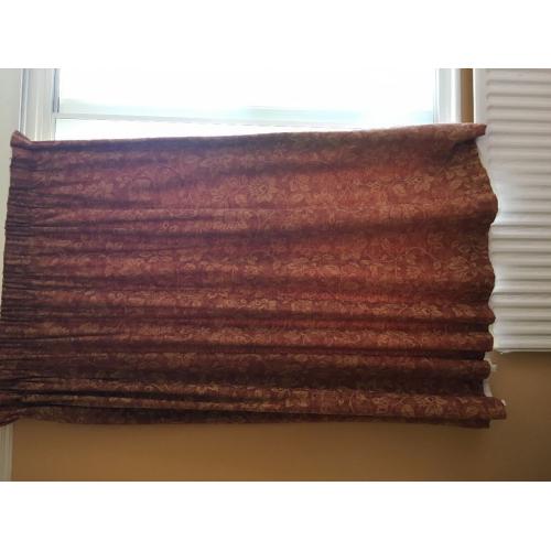 terracotta brick coloured curtains with jacquard goldy yellow flowers in a jacquard effect