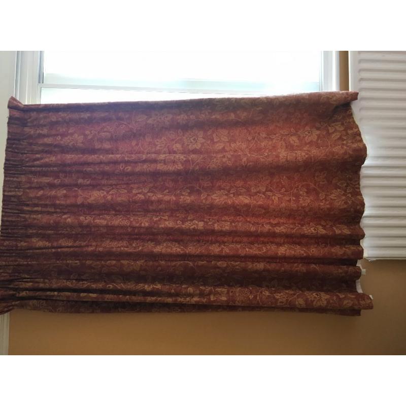 terracotta brick coloured curtains with jacquard goldy yellow flowers in a jacquard effect