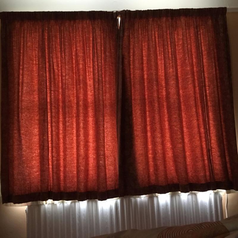 terracotta brick coloured curtains with jacquard goldy yellow flowers in a jacquard effect