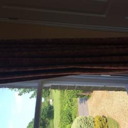 terracotta brick coloured curtains with jacquard goldy yellow flowers in a jacquard effect
