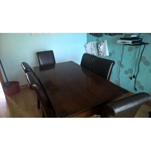 6 Seater Dining Table - Dark wood table with 6 matching dining chairs.....