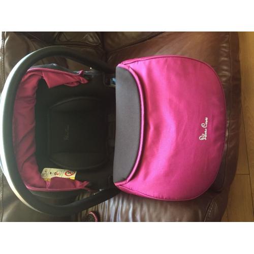 Silver cross new born car seat in raspberry.