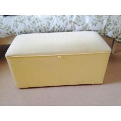 Pale yellow ottoman