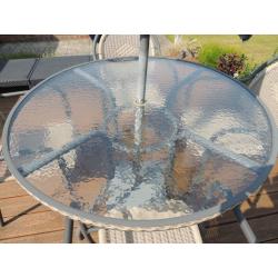 Patio table and four chairs for sale