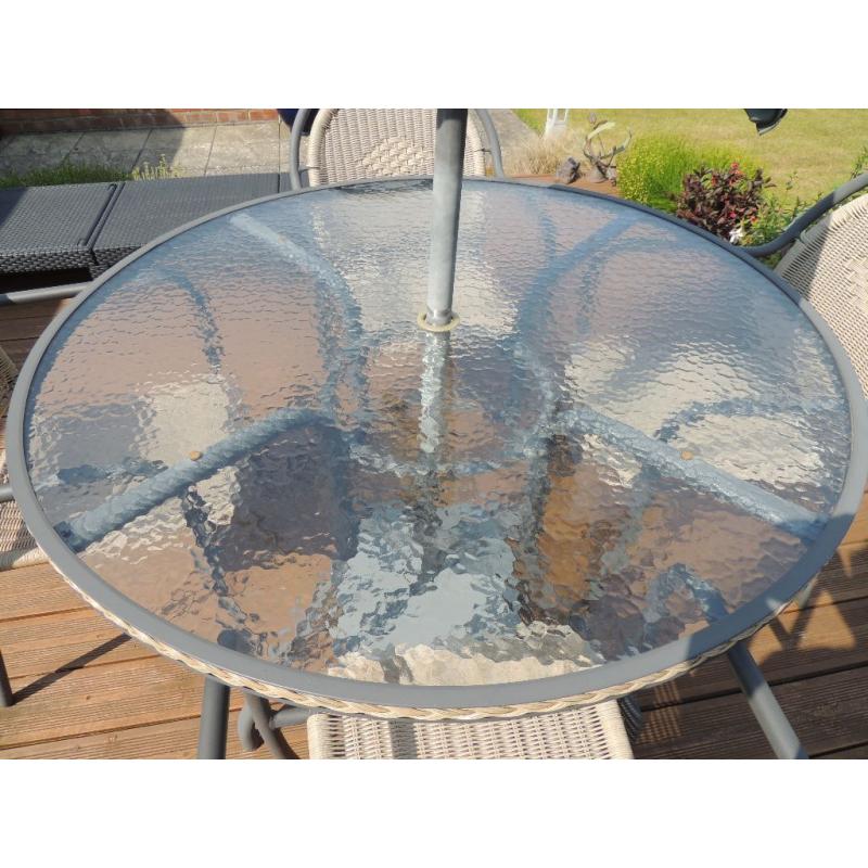 Patio table and four chairs for sale