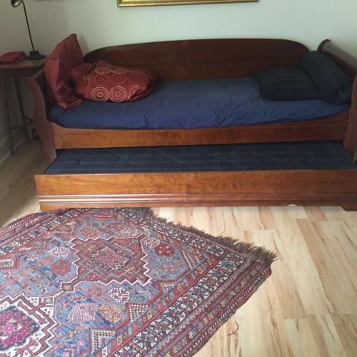 Day bed which converts into double bed or two singles. 2 meters in length.