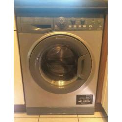 Silver Hotpoint washing machine.