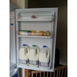 Tall Indesit fridge-freezer.