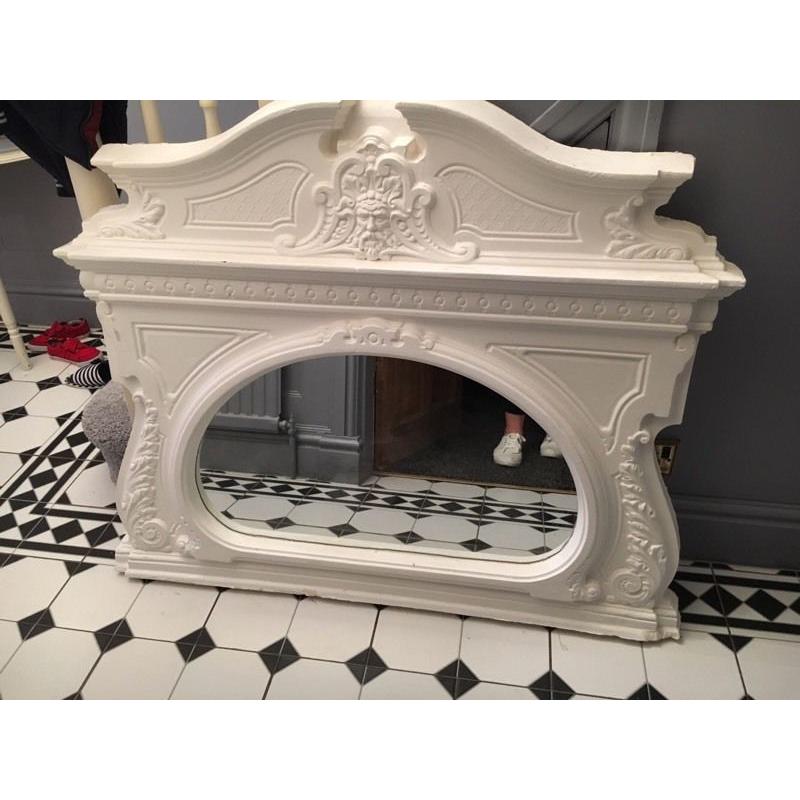 Plaster over mantel mirror