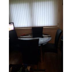 Glass Dinning Table with Stainless Steel legs with 4 High Back Leather Seats