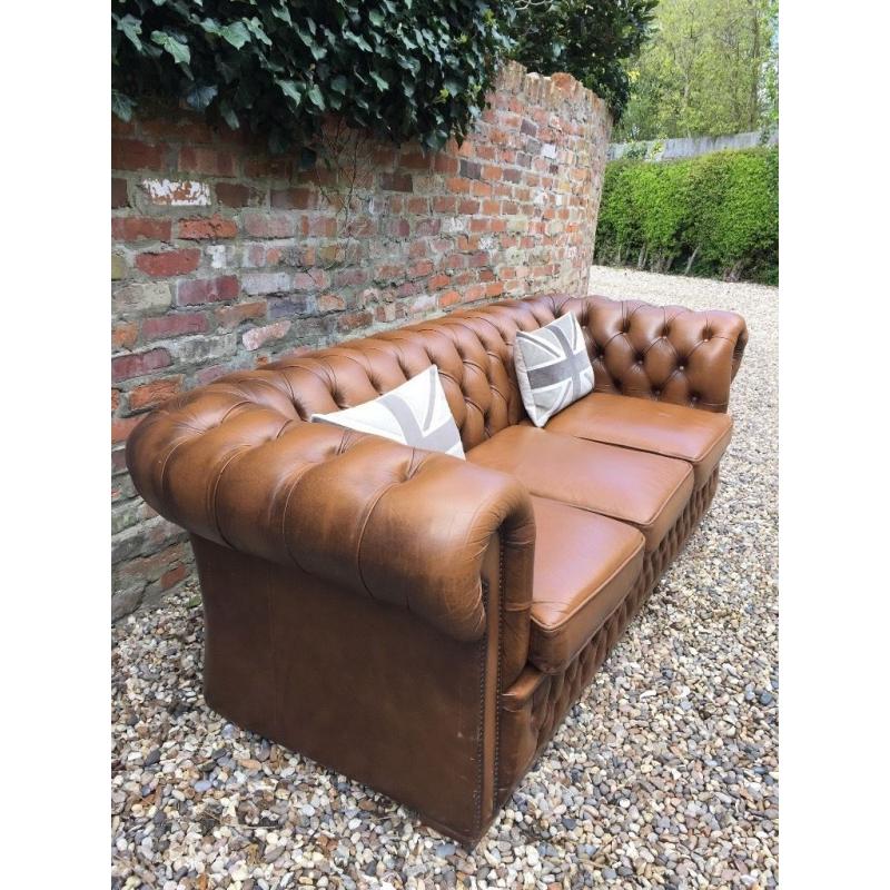Tan leather Chesterfield sofa. Can deliver.