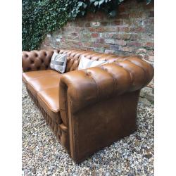 Tan leather Chesterfield sofa. Can deliver.