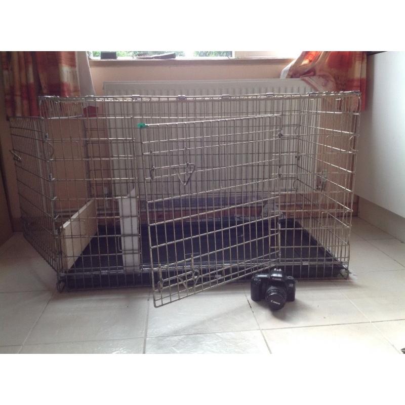 Very large dog crate. Will fit Lab, Goldie or other large dogs. Two doors, good condition.