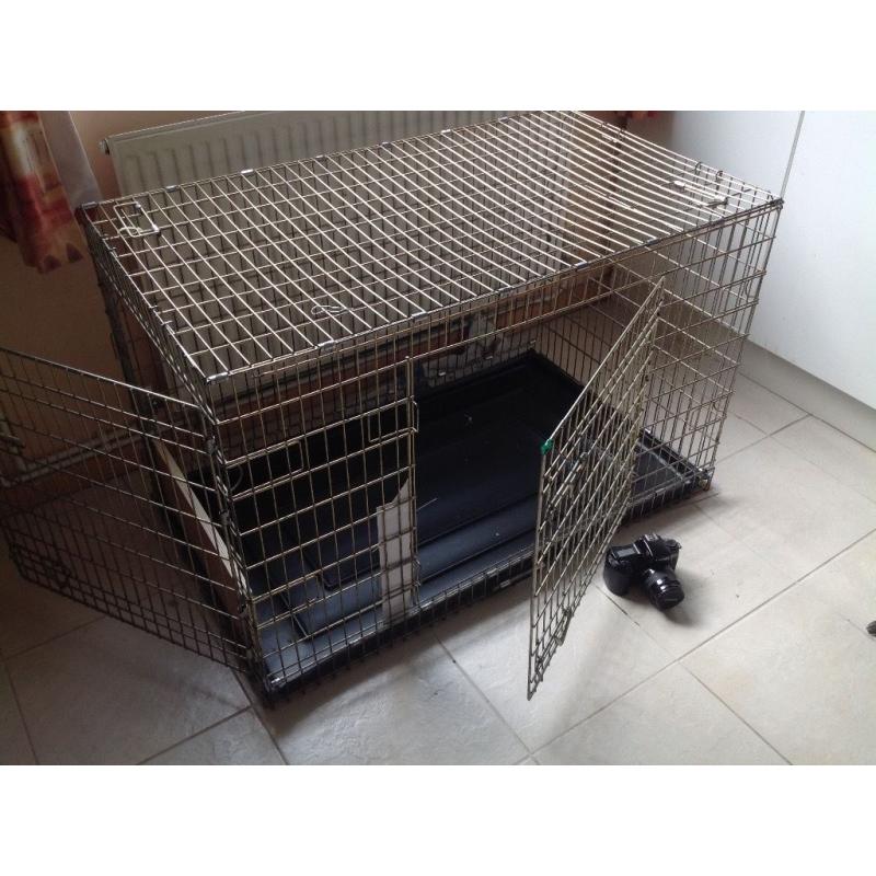 Very large dog crate. Will fit Lab, Goldie or other large dogs. Two doors, good condition.