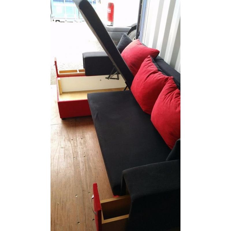 BLACK & RED CORNER SOFA BED WITH STORAGE & A MATCHING CHAIR FOR SALE.