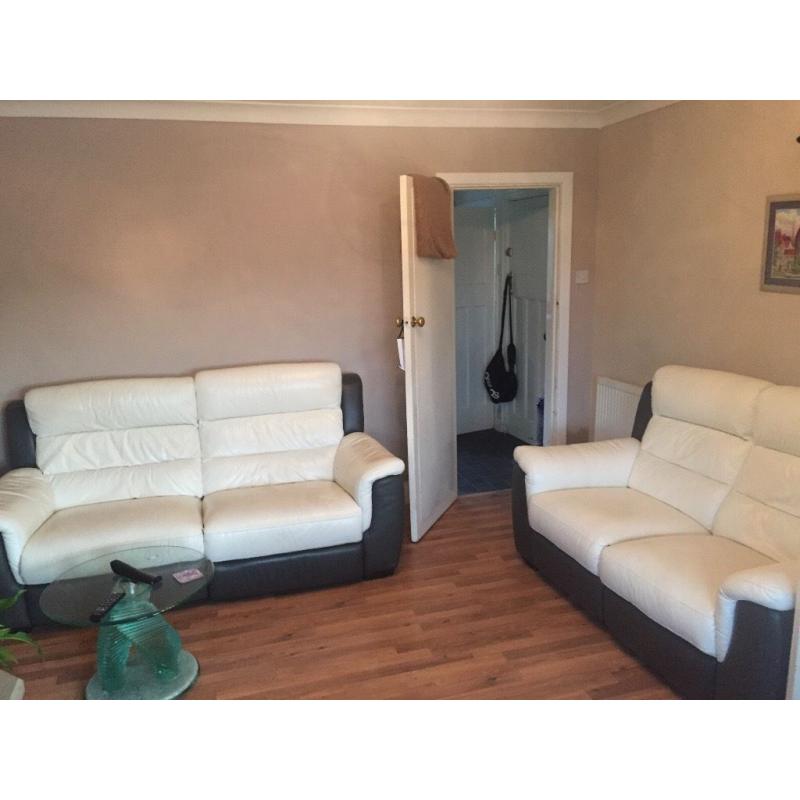 Two white and brown sofas in great condition one year old