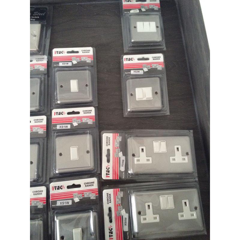 Box of brushed chrome electric switches by I-Tec
