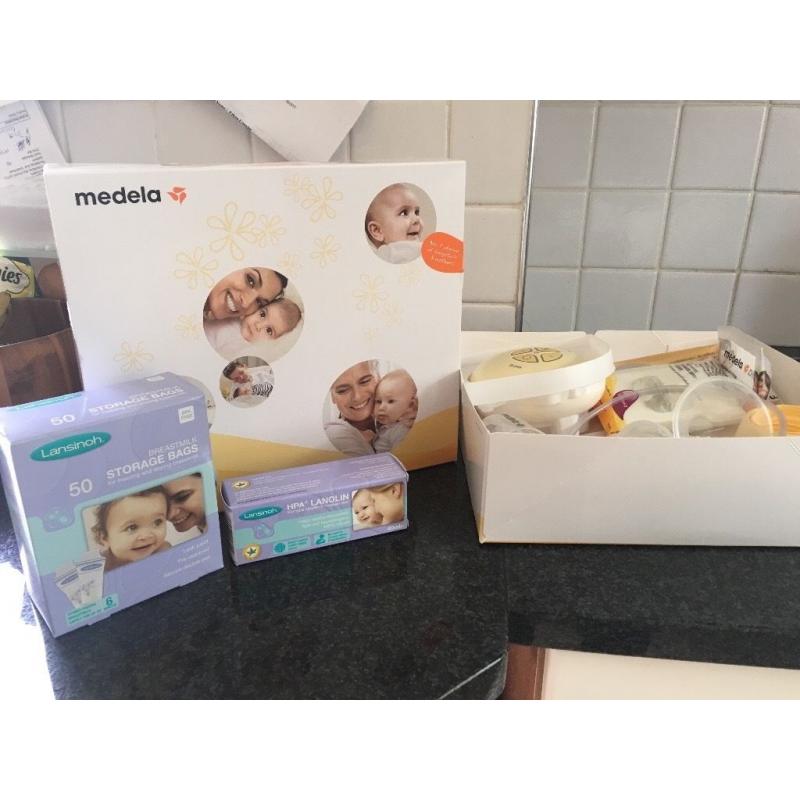 **** Medela Electric Breast Pump 1 week old hardly used *****
