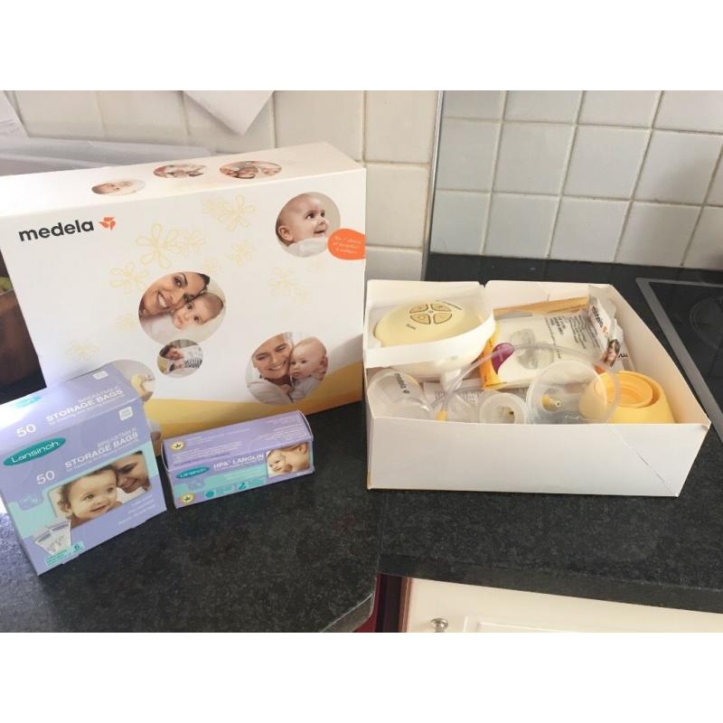 **** Medela Electric Breast Pump 1 week old hardly used *****