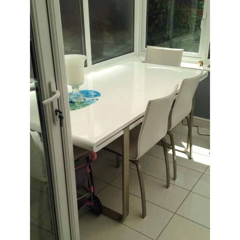 White gloss dining table and six chairs