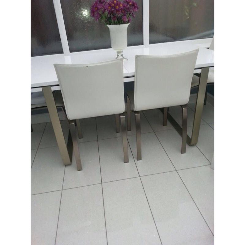 White gloss dining table and six chairs
