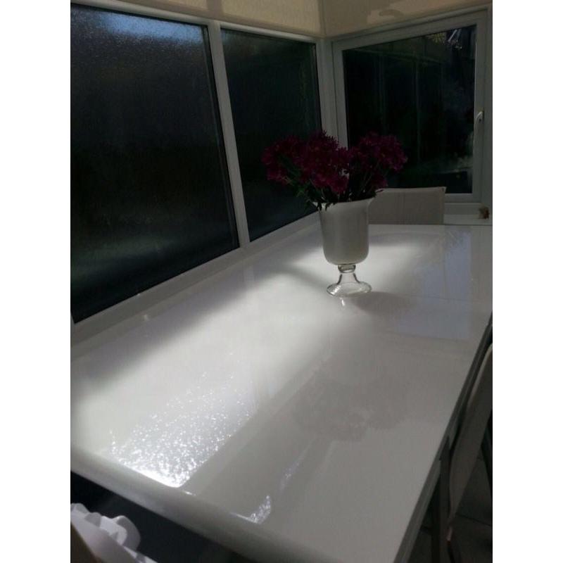 White gloss dining table and six chairs