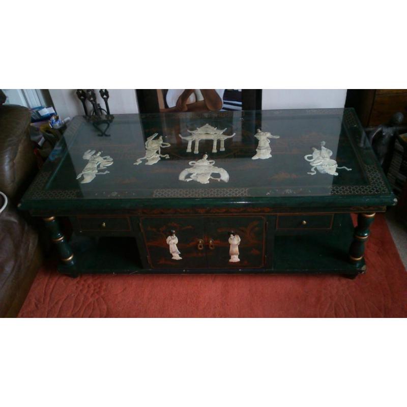 Oriental inlayed table with glass top over mother of pearl