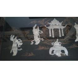 Oriental inlayed table with glass top over mother of pearl