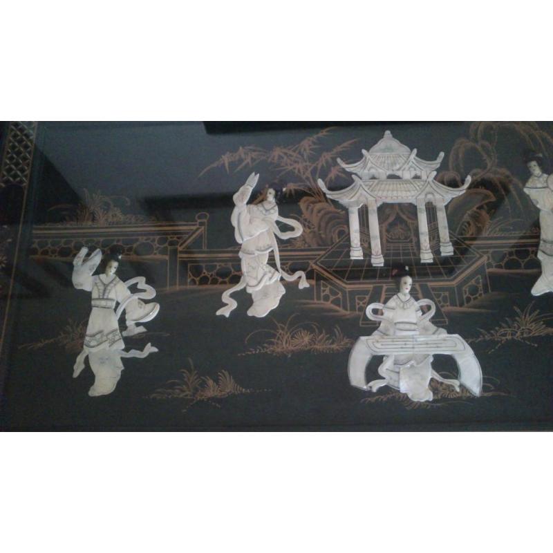 Oriental inlayed table with glass top over mother of pearl