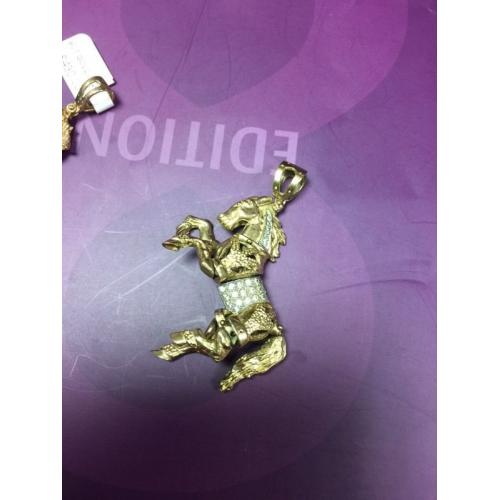 Beautiful 9ct gold stone set moving horse