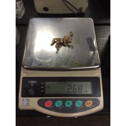 Beautiful 9ct gold stone set moving horse