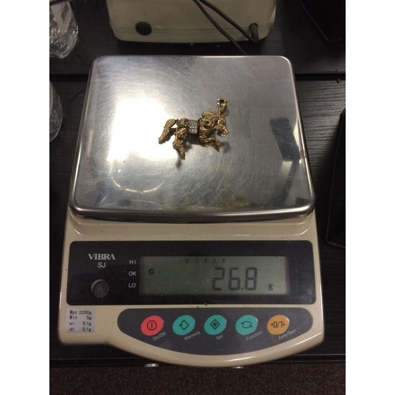Beautiful 9ct gold stone set moving horse
