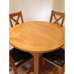 Oak extending dining table and 4 chairs