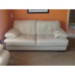 Two seater winter white leather sofa with foot stool