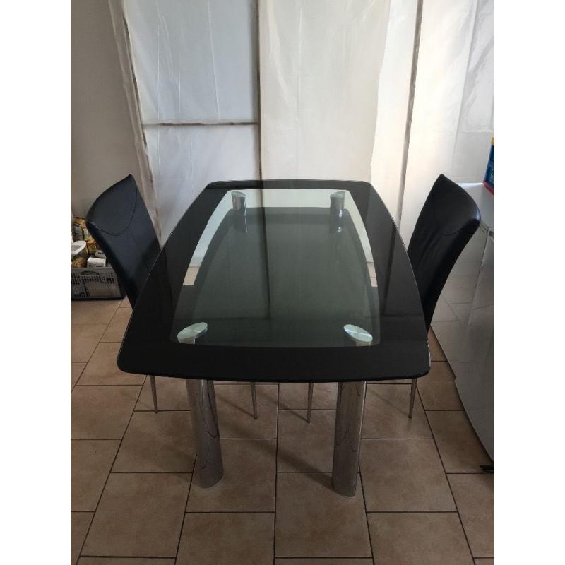 Glass top dining room table and four chairs, plus matching coffee table