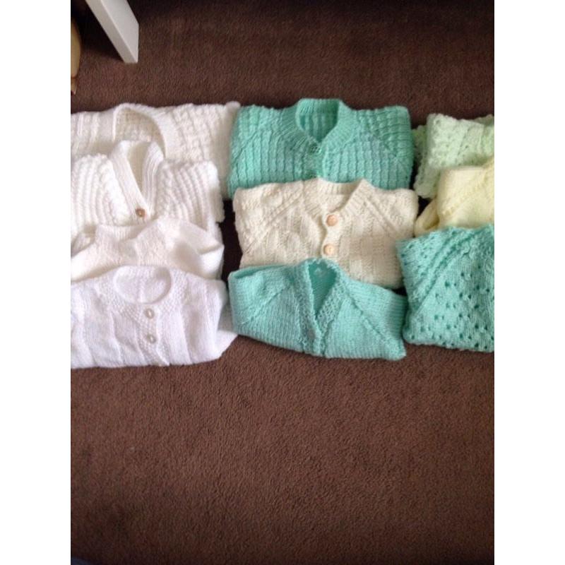 10 unisex hand knitted cardigans. Never worn 0-3 months