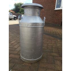 Large silver milk churn