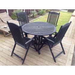 Garden table and reclining chairs