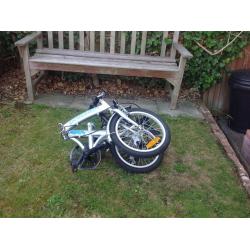 2 fold away bikes in good condition complete with carry bags