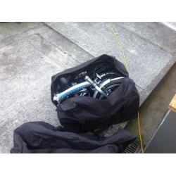 2 fold away bikes in good condition complete with carry bags