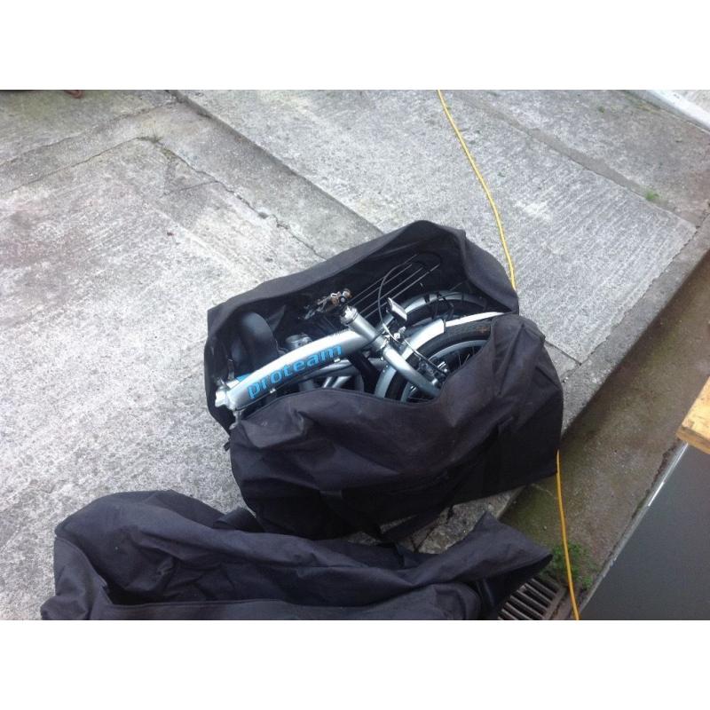 2 fold away bikes in good condition complete with carry bags