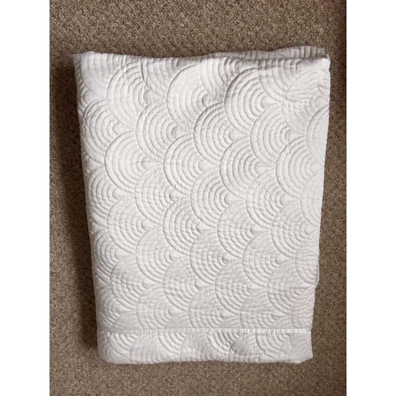 Ivory coloured bedspread