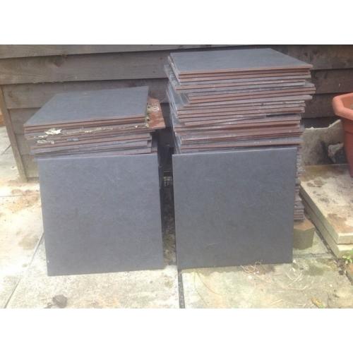 Black floor tiles. Approx 10sq meters